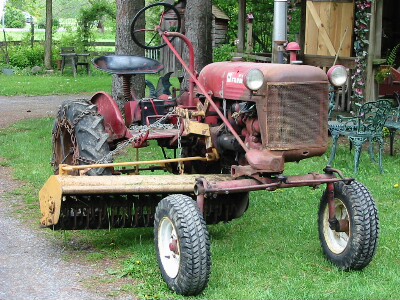 Mott Flail Mower center mounted on an early Farmall Cub Joe Therrien